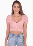 Crop top con escote cruzado y mangas embombadas color rosado para mujer - Flashy