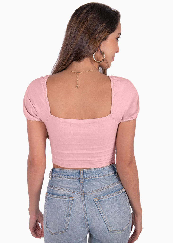 Crop top con escote cruzado y mangas embombadas color rosado para mujer - Flashy