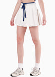 Falda corta con pliegues y anudado en contraste color blanco, marfil para mujer - Flashy