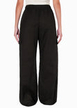 Pantalón ancho tipo lino con bolsillos cargo, elástico en cintura y anudado color negro para mujer - Flashy